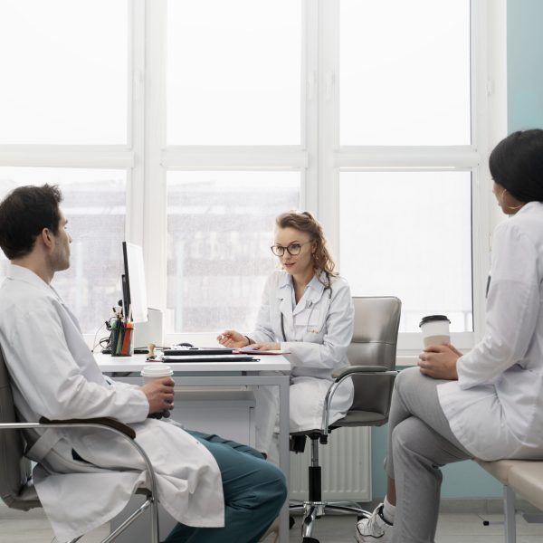 doctors-discussing-work-with-coffee-cups